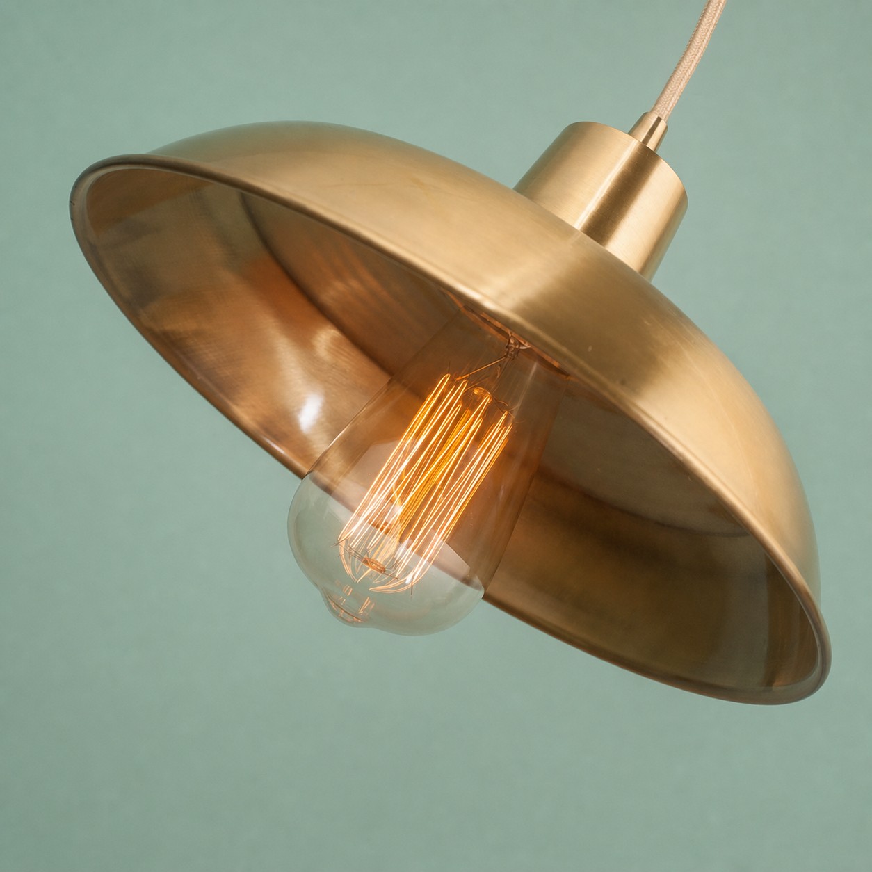 Angled brushed brass pendant shade detail