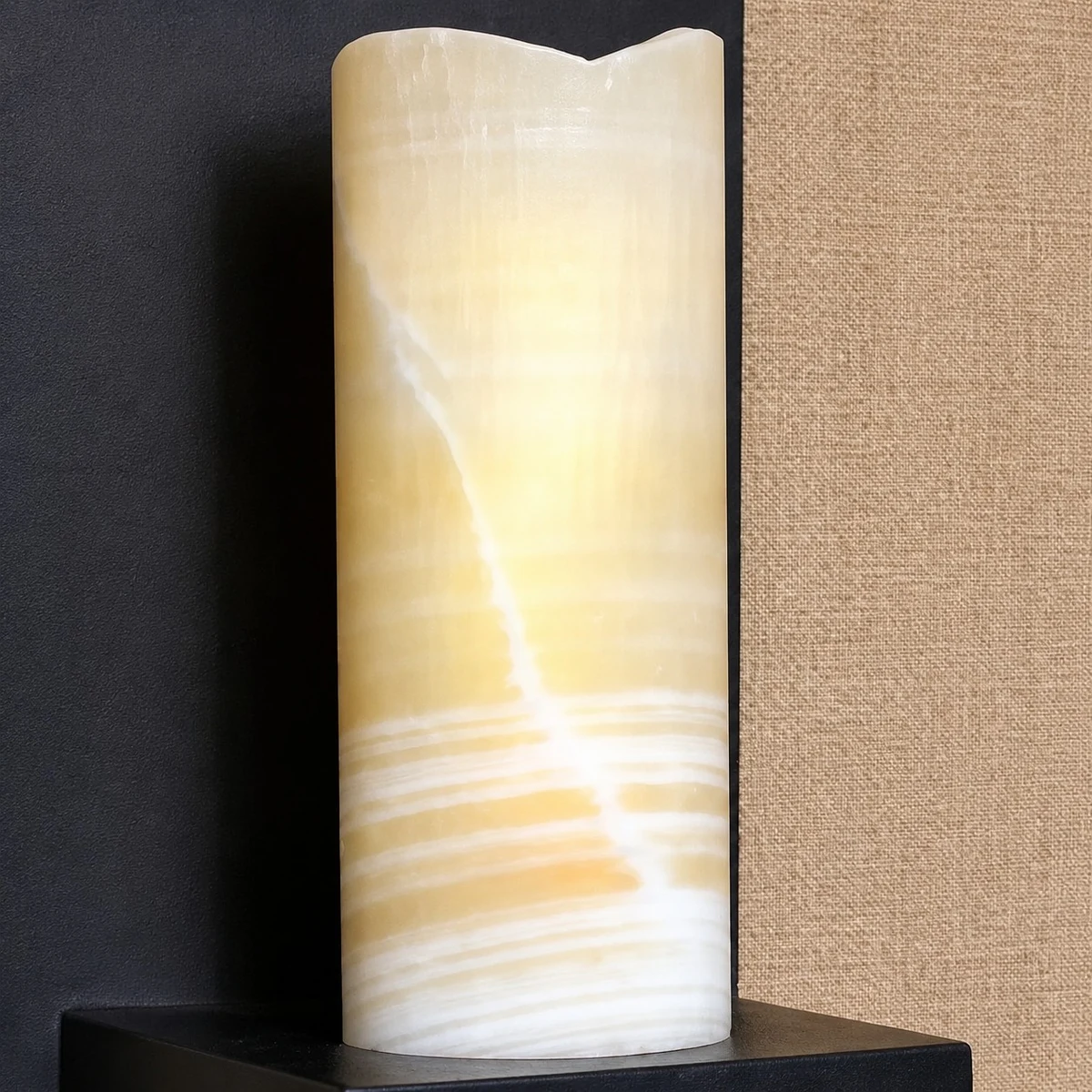Rustic black metal wall sconce detail